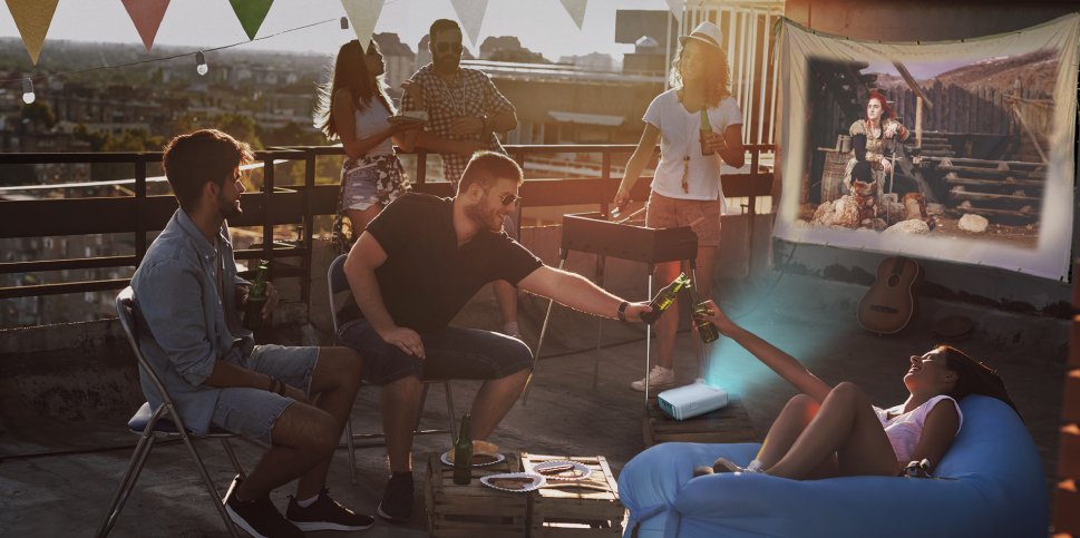 Use your projector to hold a rooftop movie night. EZCast portable projectors are perfect for this.