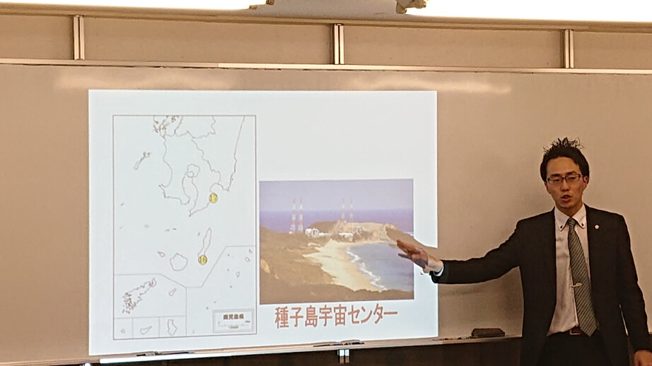 A teacher explaining about rocket launching pads in a class.